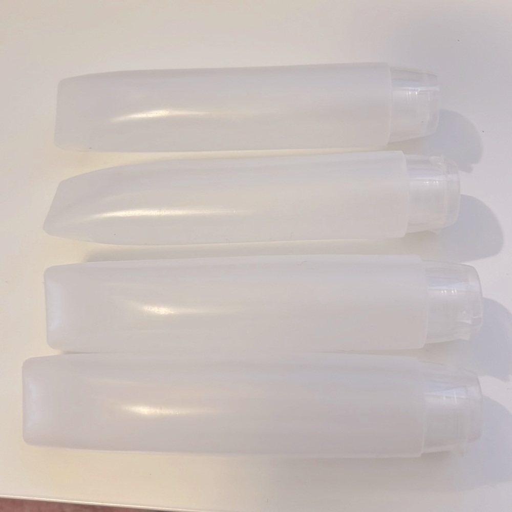 4 Travel Bottles 50ml each